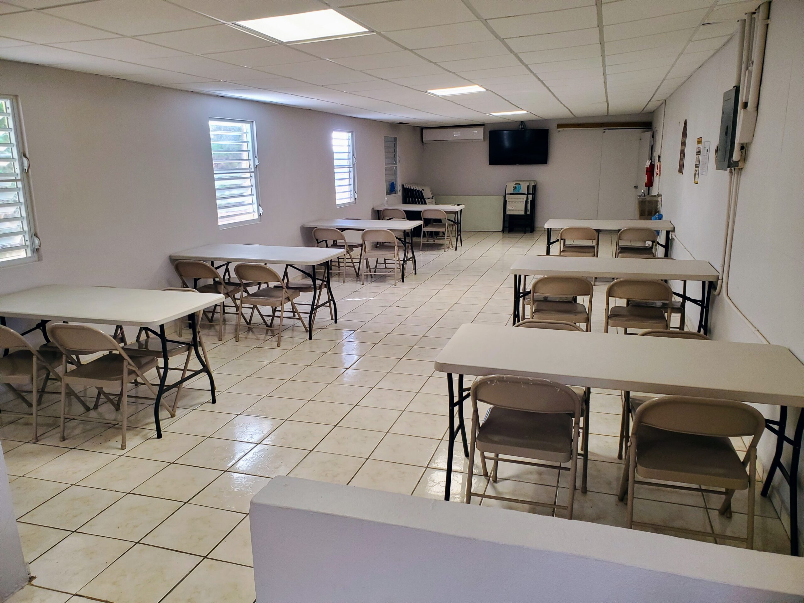 A large room with tables and chairs will serve as the dining area and worship room.