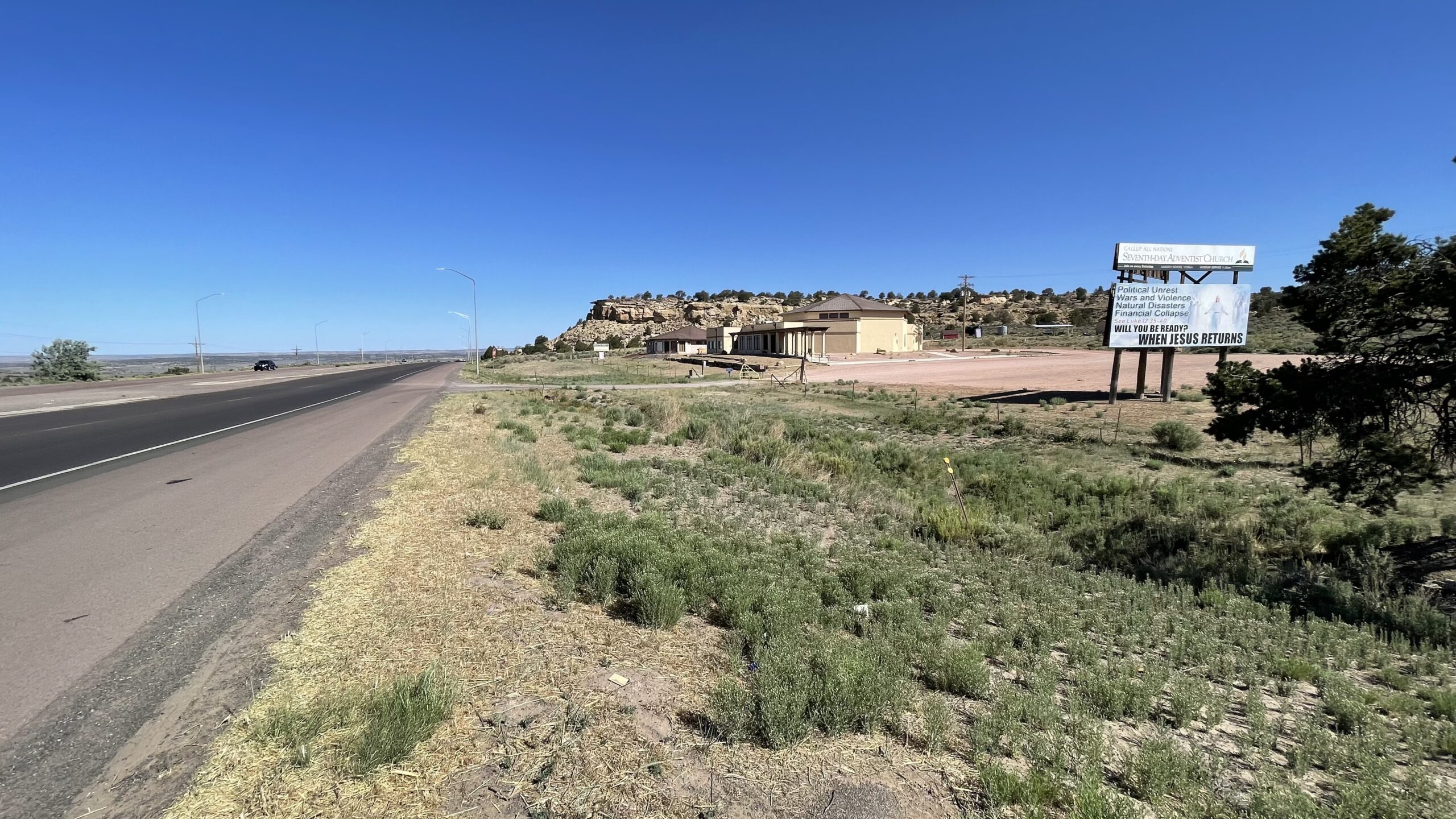 Main road into the Navajo Reservation passing right by the Gallup SDA Church with the church owned Billboard reminding people of Jesus return.
